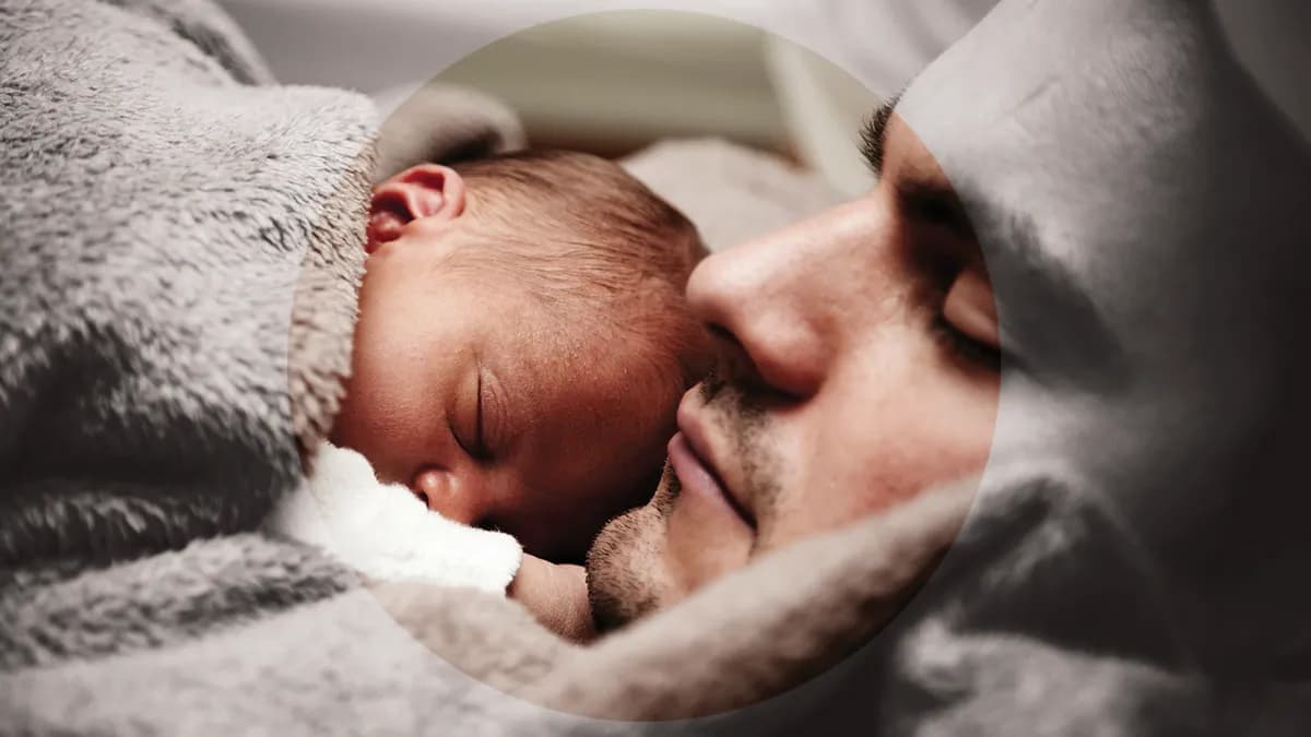 A man holding a baby