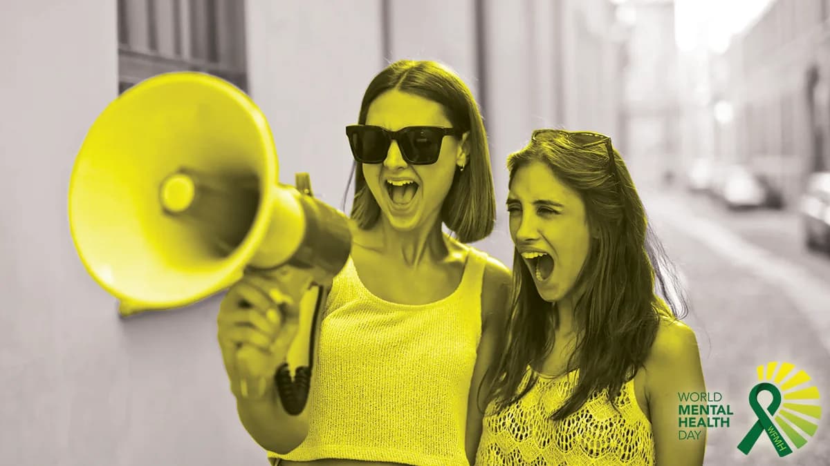 Two people shouting into a megaphone.